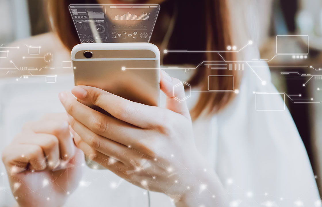 woman holding a cellphone with images of technology connections sprouting up from it