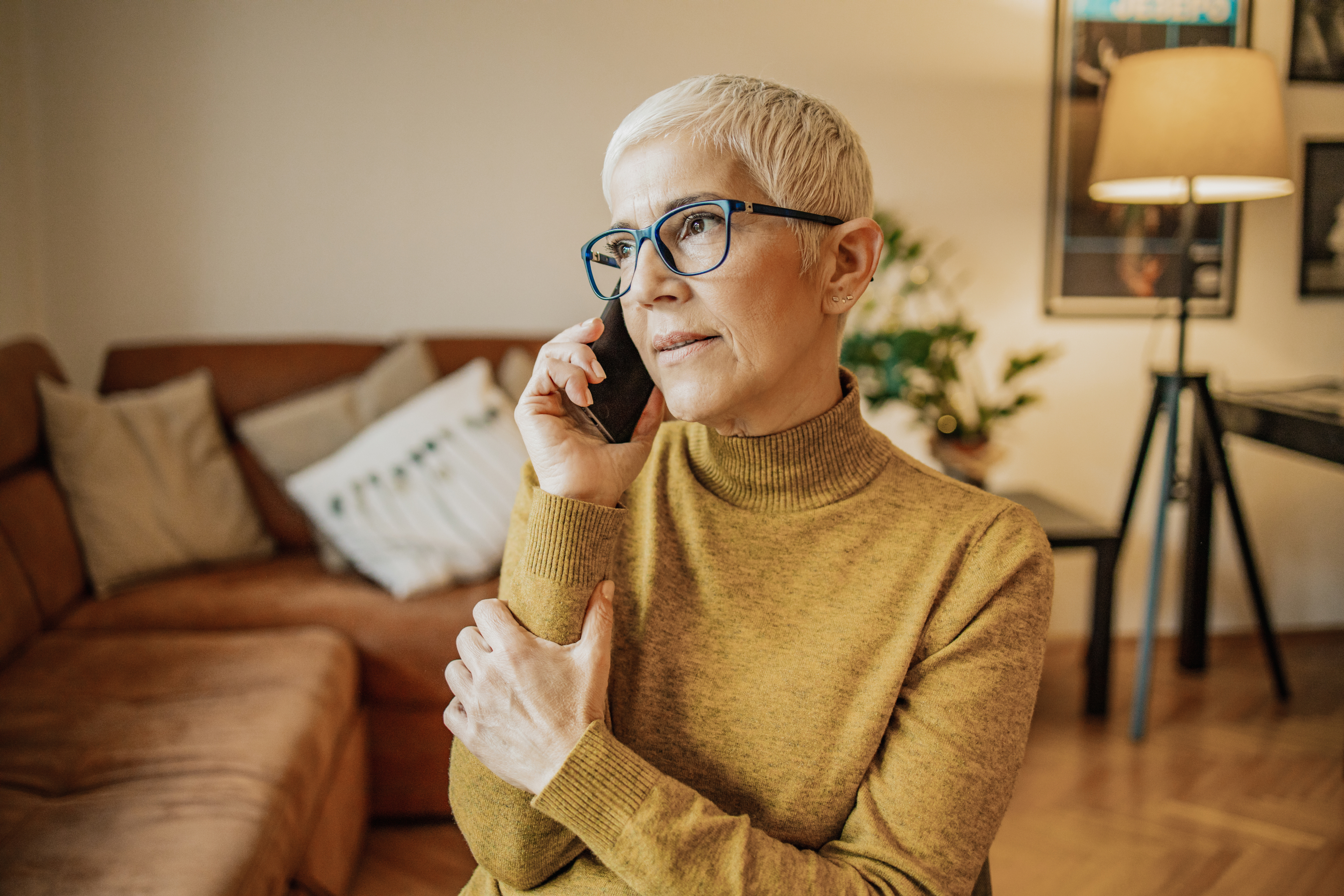 Older woman on phone looking concerned